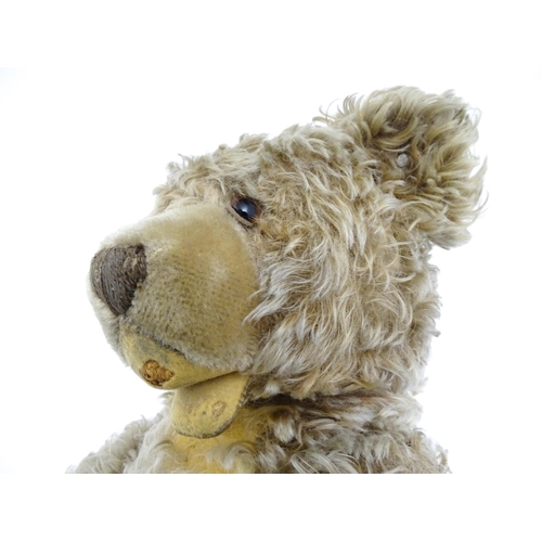 1440 - Toy: A 20thC Steiff straw filled mohair teddy bear - Zotty, with stitched nose, open mouth, articula... 