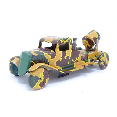 1456 - Toys: An early 20thC tin plate clockwork military vehicle with camouflage detail, two seated soldier... 