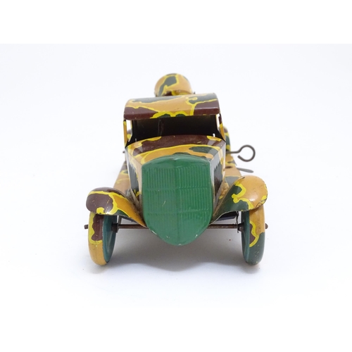 1456 - Toys: An early 20thC tin plate clockwork military vehicle with camouflage detail, two seated soldier... 