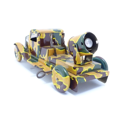 1456 - Toys: An early 20thC tin plate clockwork military vehicle with camouflage detail, two seated soldier... 