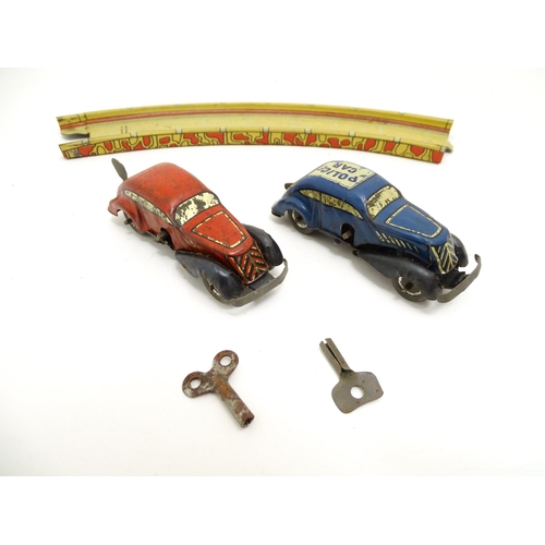 1462 - Toys: An early 20thC Lumar Toys tinplate Speed Trap clockwork game. Together with a Hen Laying Eggs ... 