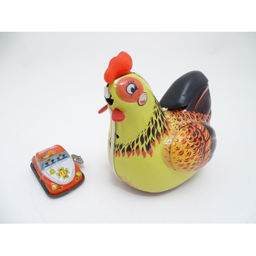 1462 - Toys: An early 20thC Lumar Toys tinplate Speed Trap clockwork game. Together with a Hen Laying Eggs ... 