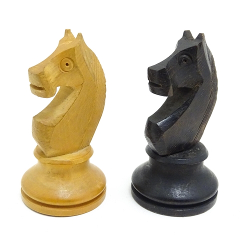 1463 - Toys: A quantity of chess pieces contained within a box with sliding lid and brass handle. (33 piece... 