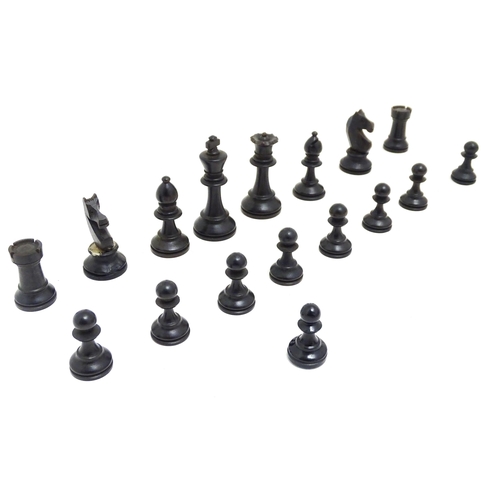 1463 - Toys: A quantity of chess pieces contained within a box with sliding lid and brass handle. (33 piece... 