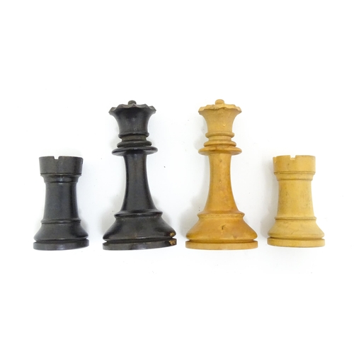 1463 - Toys: A quantity of chess pieces contained within a box with sliding lid and brass handle. (33 piece... 