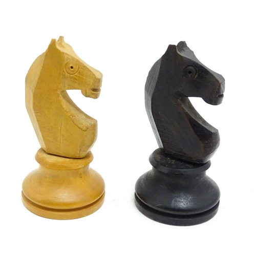 1463 - Toys: A quantity of chess pieces contained within a box with sliding lid and brass handle. (33 piece... 