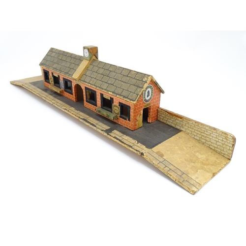 1468 - Toys: A 20thC scratch built wooden model railway station / platform with various adverts for Shell, ... 