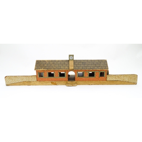 1468 - Toys: A 20thC scratch built wooden model railway station / platform with various adverts for Shell, ... 