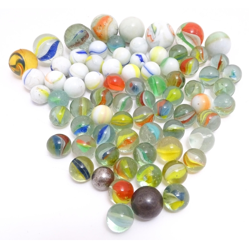 1469 - A quantity of assorted glass marbles, many with colours twists. Largest approx. 1