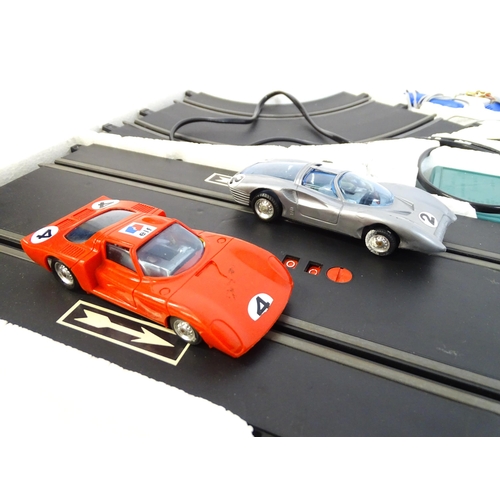 1474 - Toys: Two 20thC car racing games comprising TCR Total Control Racing Lighted Jam Car Speedway, and P... 