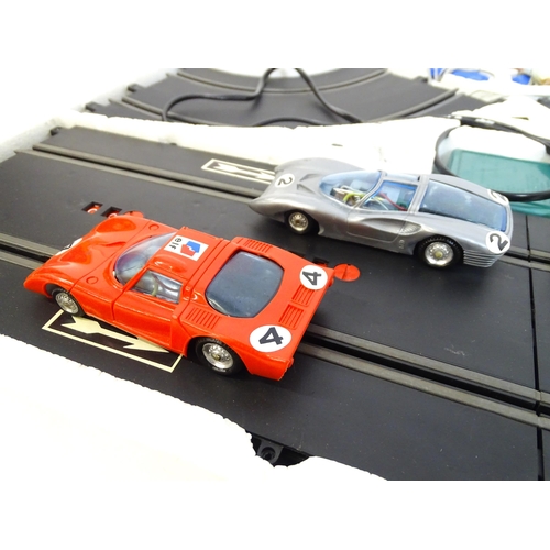 1474 - Toys: Two 20thC car racing games comprising TCR Total Control Racing Lighted Jam Car Speedway, and P... 