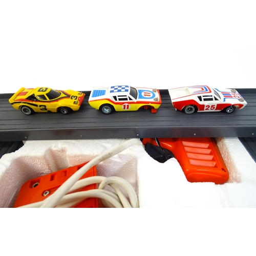 1474 - Toys: Two 20thC car racing games comprising TCR Total Control Racing Lighted Jam Car Speedway, and P... 