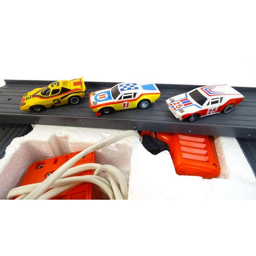 1474 - Toys: Two 20thC car racing games comprising TCR Total Control Racing Lighted Jam Car Speedway, and P... 