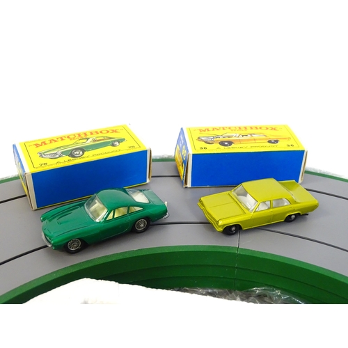 1476 - Toy: A boxed mid 20thC Lesney Matchbox M-2 Motorised Motorway set, containing boxed and loose vehicl... 