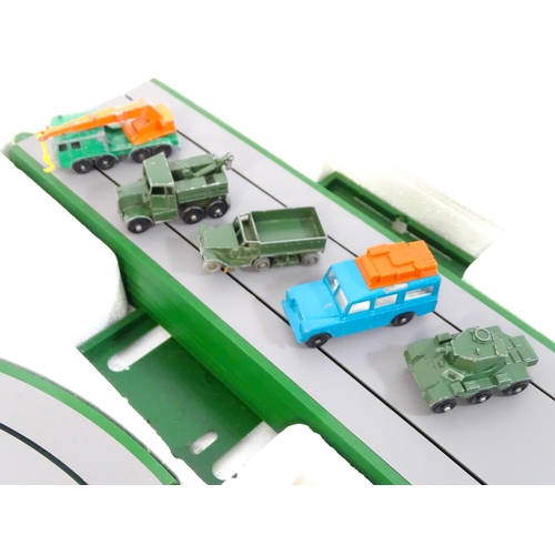 1476 - Toy: A boxed mid 20thC Lesney Matchbox M-2 Motorised Motorway set, containing boxed and loose vehicl... 