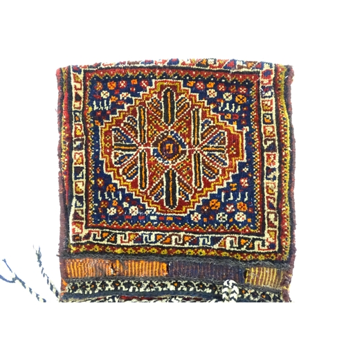 1532 - Rug : A woollen saddle bag style rug, decorated with stylised floral and geometric motifs. Approx. 3... 