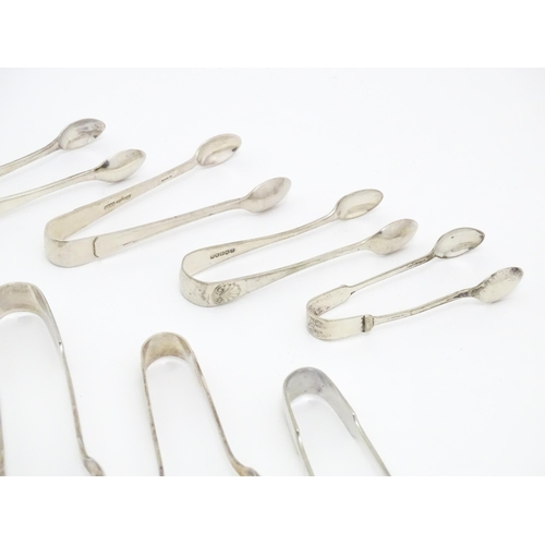 600 - A large quantity of silver plate sugar tongs, various patterns (20)