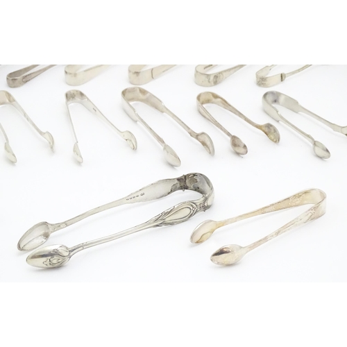 600 - A large quantity of silver plate sugar tongs, various patterns (20)