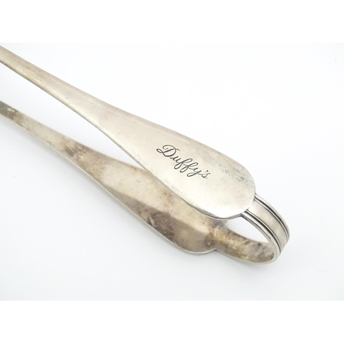 600 - A large quantity of silver plate sugar tongs, various patterns (20)