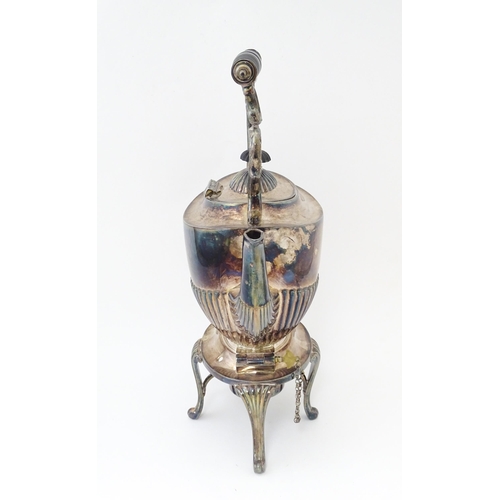 602 - A late 19th / early 20thC silver plate spirit kettle on stand with burner under. Approx. 13