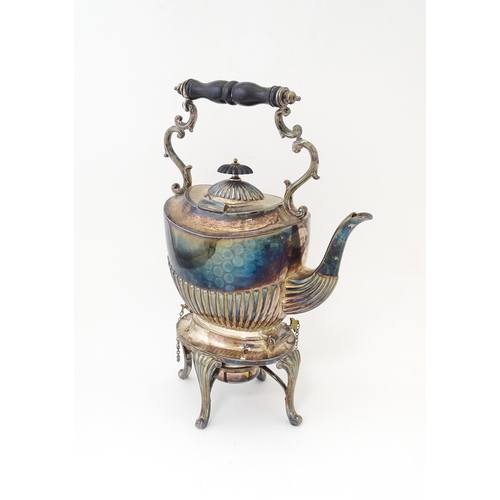 602 - A late 19th / early 20thC silver plate spirit kettle on stand with burner under. Approx. 13