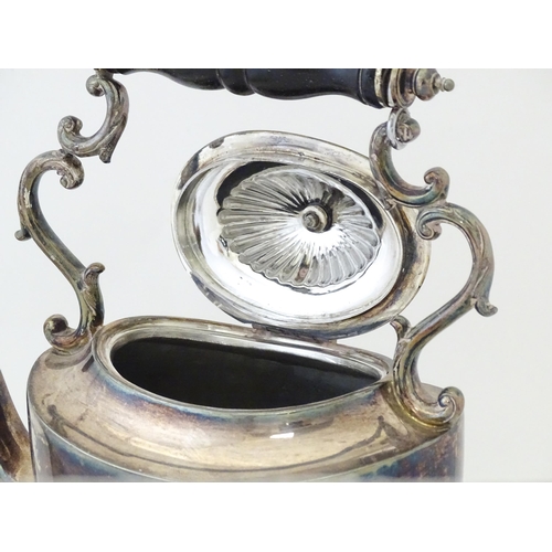 602 - A late 19th / early 20thC silver plate spirit kettle on stand with burner under. Approx. 13