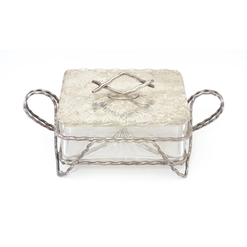 603 - A glass and silver plate butter dish with  textured detail and naturalistic formed handle. Maker Huk... 