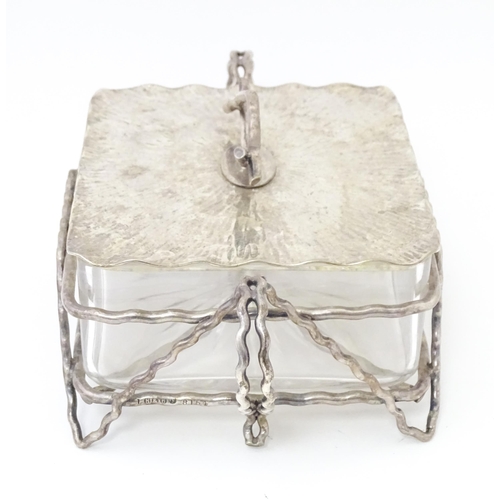 603 - A glass and silver plate butter dish with  textured detail and naturalistic formed handle. Maker Huk... 