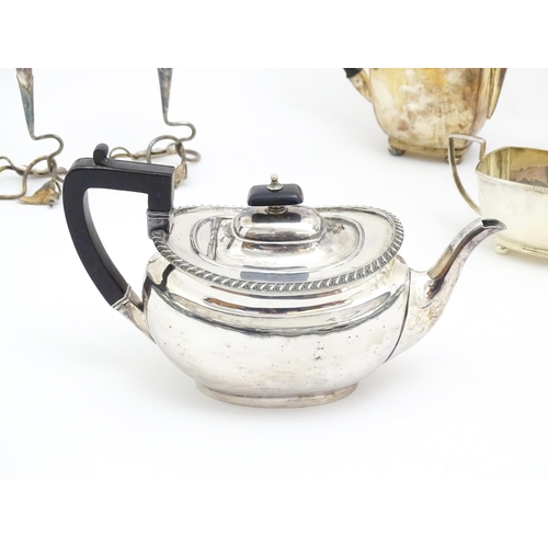 606 - A quantity of assorted silver plated wares to include napkin rings, tea set, table centrepiece eperg... 