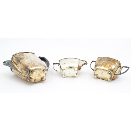 606 - A quantity of assorted silver plated wares to include napkin rings, tea set, table centrepiece eperg... 