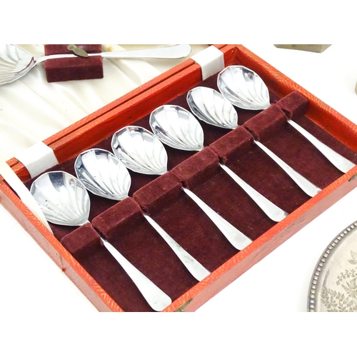 608 - A quantity of assorted silver plated wares to include cigarette box, wine funnels, spoons, ash tray ... 