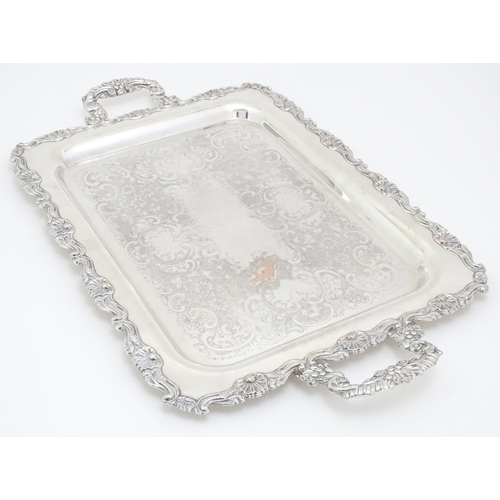 609 - A quantity of assorted silver plated wares comprising toast racks, salad servers, cake basket and tr... 