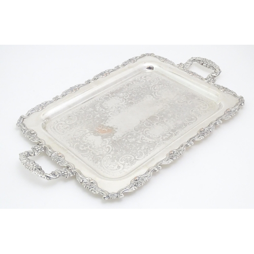 609 - A quantity of assorted silver plated wares comprising toast racks, salad servers, cake basket and tr... 