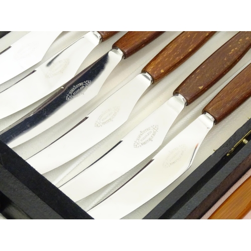 609A - A quantity of assorted mid century / retro silver plate flatware / cutlery, to include wooden handle... 