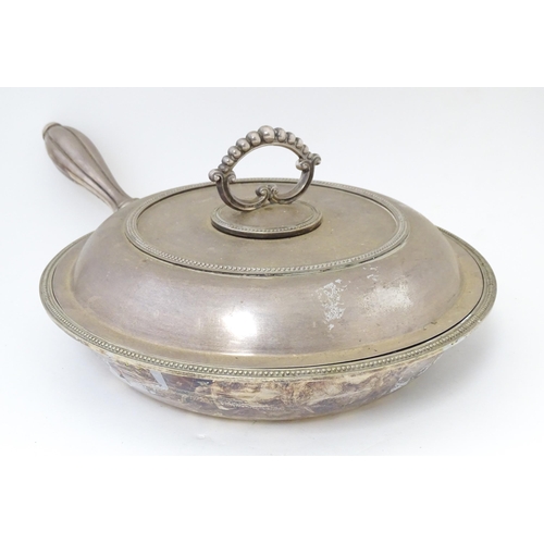 611 - A silver plate lidded warming dish, opening to reveal sections within. Approx. 17