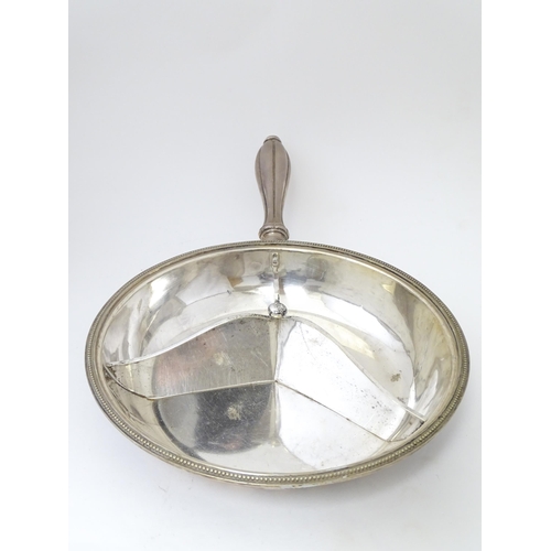 611 - A silver plate lidded warming dish, opening to reveal sections within. Approx. 17