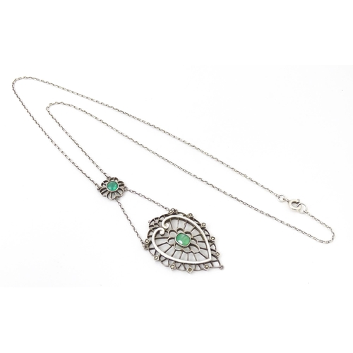 736 - A silver necklace with Art Noveau style pendant set with white enamel,  green stone and marcasite de... 