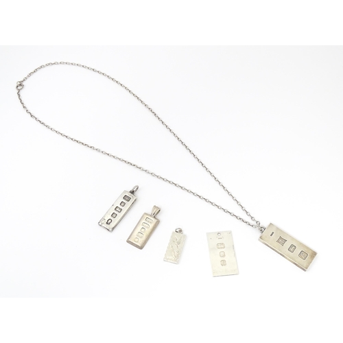 745 - Five various silver ingot formed pendants, one on a silver chain . The chain approx 24