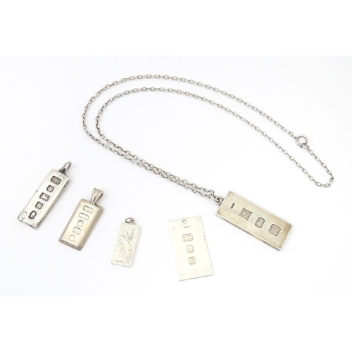 745 - Five various silver ingot formed pendants, one on a silver chain . The chain approx 24