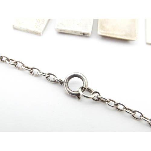 745 - Five various silver ingot formed pendants, one on a silver chain . The chain approx 24