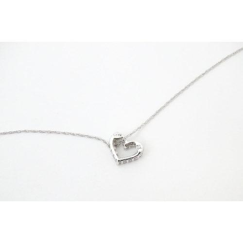 751 - A 14ct white gold pendant of heart form set with diamonds, with a with a 14ct white gold necklace ch... 