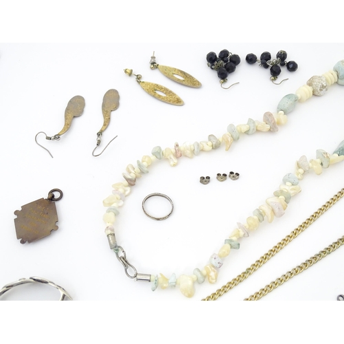 755 - A quantity of assorted costume jewellery to include a pendant with enamel detail and central model o... 