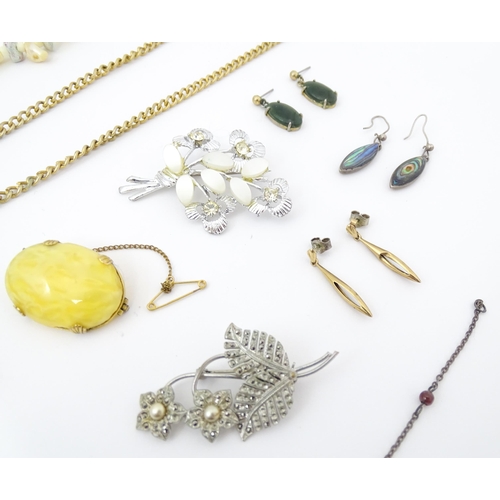 755 - A quantity of assorted costume jewellery to include a pendant with enamel detail and central model o... 