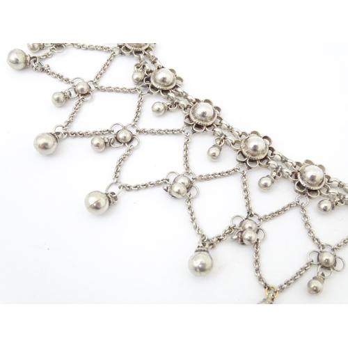 795 - A white metal festoon choker necklace silver cabochon and bead detail. 15