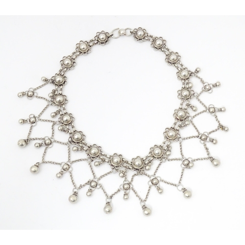 795 - A white metal festoon choker necklace silver cabochon and bead detail. 15