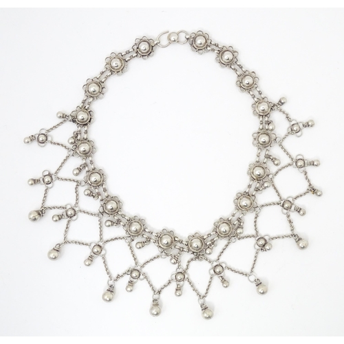 795 - A white metal festoon choker necklace silver cabochon and bead detail. 15