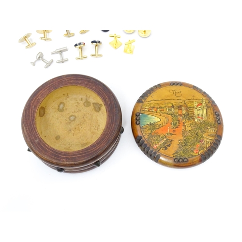 797 - A quantity of assorted cufflinks to include a silver gilt pair, contained within a novelty souvenir ... 