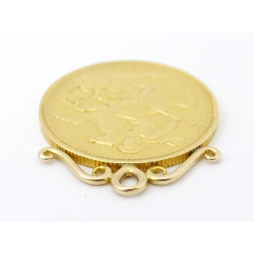 802 - A pendant formed as a Victorian 2 pound / double sovereign with hanging mount to top. Approx 1 1/4