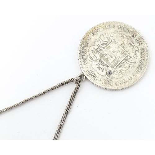 803 - A white metal longuard / watch chain with pendant formed from a silver Venezuelan coin dated 1921 an... 