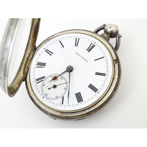 831 - A Continental .935 silver key wind pocket watch. The dial and movement marked signed 'Sans Pareil' .... 